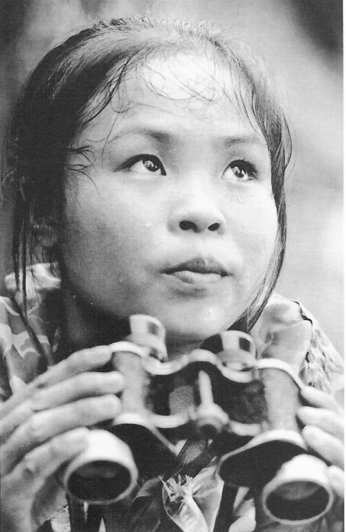 Viet Cong Youth Volunteer La Thi Tam counts bombs dropped by American bombers. This was to enable delayed-fuse bombs to be located and deactivated. 1967